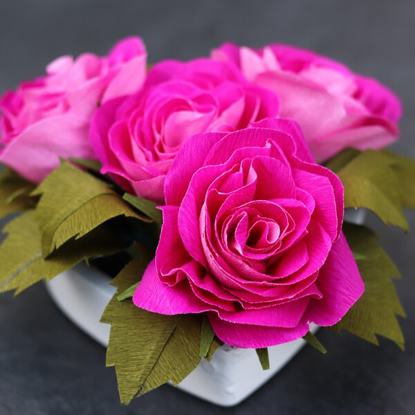 Roses made from doublette crepe paper in a ceramic heart