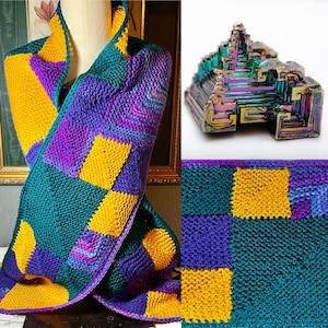 May include: A handmade, knitted scarf in a patchwork design. The scarf features squares of teal, purple, and gold yarn. A colorful bismuth crystal is also shown. The scarf is displayed on a mannequin.