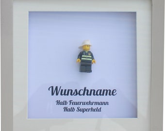 LEGO® Feuerwehrmann in weissen Rahmen "Halb Feuerwehrmann - Halb Superheld" mit Wunschnamen