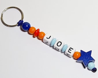 Sleutelhanger | Taschenbaumler "STERN". Naam hanger, jongen, gepersonaliseerd, hout, rood, blauw, oranje, doop, schooltas, rugzak