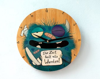 Wanduhr handbemalt Monster Spruch: " Die Zeit heilt alle Wunden!"