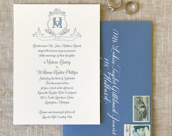May include: A white wedding invitation with a blue crest featuring the letter "H" and the date "7.3.16". The invitation announces the marriage of Malone Barry to William Hunter Phillips on September 3rd, 2016 at 5:00 PM at the Epworth Heights Hotel Courtyard in Ludington, Michigan. The reception will be held at the Lincoln Hills Country Club.