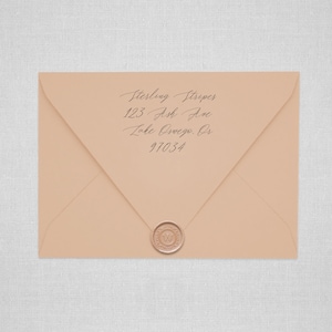 May include: A light brown envelope with a handwritten address that reads "Sterling Stripes, 123 Ash Ave, Lake Oswego, OR 97034". The envelope has a wax seal with the letter "W" in the center.