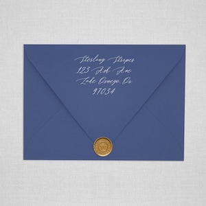 May include: A blue envelope with a gold wax seal. The envelope is addressed to Sterling Stripes, 123 Ash Ave, Lake Oswego, OR 97034.