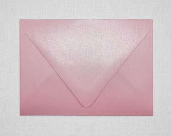 May include: A light pink envelope with a subtle shimmer finish.