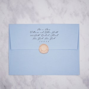 May include: A light blue envelope with a wax seal. The envelope is addressed to Mr. and Mrs. William and Goble Heath, 3189 North Central Street, New York, New York 20018.