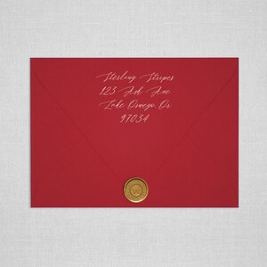 May include: Red envelope with a gold wax seal. The address is written in white ink: Sterling Striper, 123 Ash Ave, Lake Oswego, OR 97034.