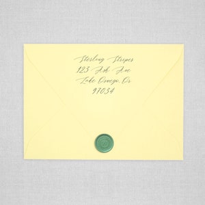 May include: A yellow envelope with a green wax seal. The address is written in cursive: Sterling Stripes, 123 Ash Ave, Lake Oswego, OR 97034.
