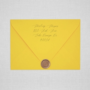 May include: A yellow envelope with a wax seal. The address is written in cursive: Sterling Stripes, 123 Ash Ave, Lake Oswego, OR 97034.