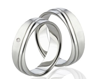 Delicate, elegant wedding rings, curved engagement rings with diamond