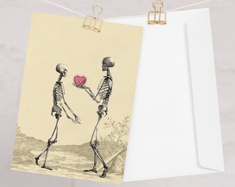 May include: Two skeletons, one holding a pink heart, stand in a romantic pose against a beige background. The skeletons are drawn in a vintage style.