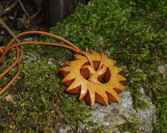 Hand-carved sun triskele as a necklace pendant, sun triskele carved from lime wood, necklace pendant 'sun triskele' hand-carved