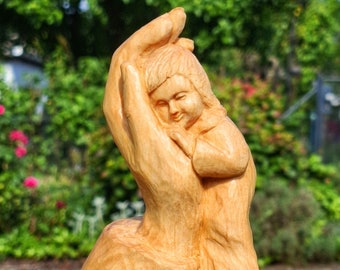 Carved wooden sculpture, hand carved from wood with child, protective motifs for security, wooden sculpture, gifts for baptism