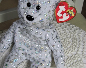 Peluche, ours, ours Beanie Baby, "The Beginning", avec étoiles pailletées, date de naissance 1er janvier 2000