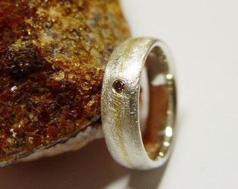 Ring in Silber und Gold mit Brillant