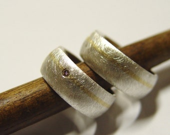 Anillos de boda en plata y oro con brillante