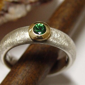 Ring with tsavorite/green garnet
