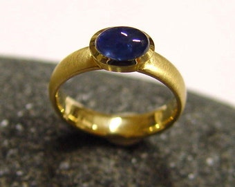Gold ring with sapphire hand-forged
