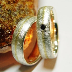 Eheringe in Silber und Gold mit schwarzem Diamant Bild 4