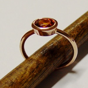 Gold ring with Mandarin garnet