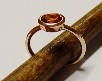 Gold ring with Mandarin garnet