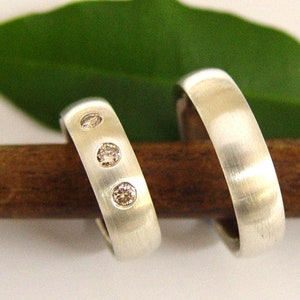 Wedding rings in silver with diamonds image 1