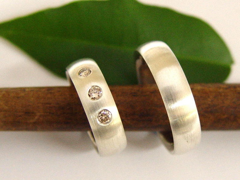 Wedding rings in silver with diamonds image 1