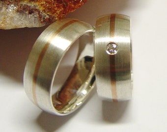 Wedding rings in silver and gold with brilliant