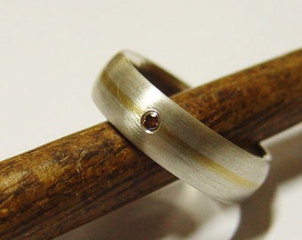 Wedding ring in silver and gold with brilliant