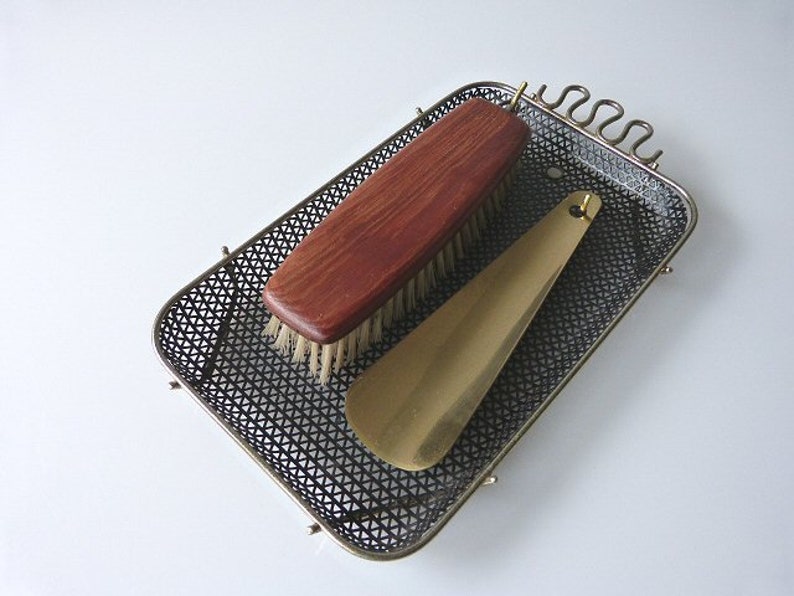Dress brush and shoe puller of the 50s