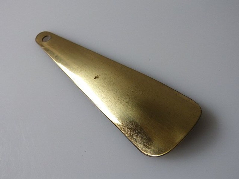 Dress brush and shoe puller of the 50s