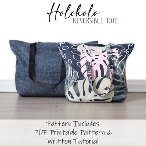 May include: Two reversible tote bags, one in a dark blue denim fabric and the other with a tropical leaf print in shades of green, pink and white. The text "Holoholo Reversible Tote" is at the top of the image. The text "Pattern Includes PDF Printable Pattern & Written Tutorial" is at the bottom of the image.