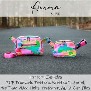 May include: Two colourful Aurora sling bags with a matching collar. The bags feature a vibrant abstract design in pink, green, and blue. The bags have a zip closure and adjustable straps. The collar has the word "HOMALEO" on it. The text "Aurora SLING" is at the top.