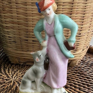 Vtg Occupied Japan Women In Green Coat Pink Dress W/Dog Porcelain Figurine