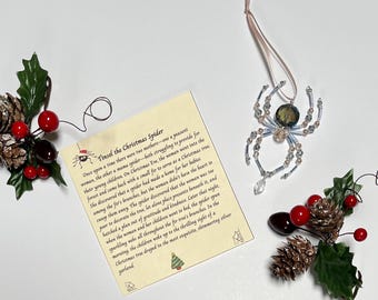 Araña navideña de cristal con tarjeta de cuento
