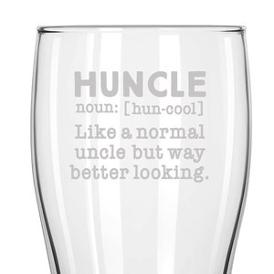 May include: A clear glass pint glass with the text "HUNCLE noun: [hun-cool] Like a normal uncle but way better looking." etched on the side.