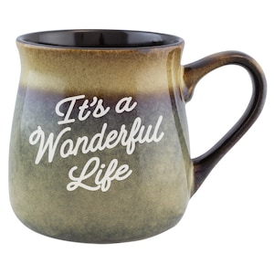 May include: A brown and green ceramic mug with a white inscription that reads "It's a Wonderful Life".