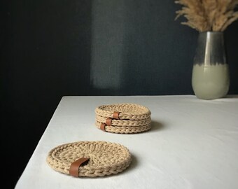 Tea or coffee coasters for table decoration, set of 4 minimalist pads woven from cotton, eco friendly product for elegant housewarming gift.