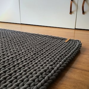 Chunky rectangular rug, crochet carpet with a minimalist simple design, indoor and outdoor decoration, esthetic living room accent.