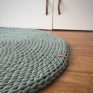 Chunky and fluffy crochet round rug, handwoven carpet with a minimalist design, indoor and outdoor decoration, esthetic living room accent.