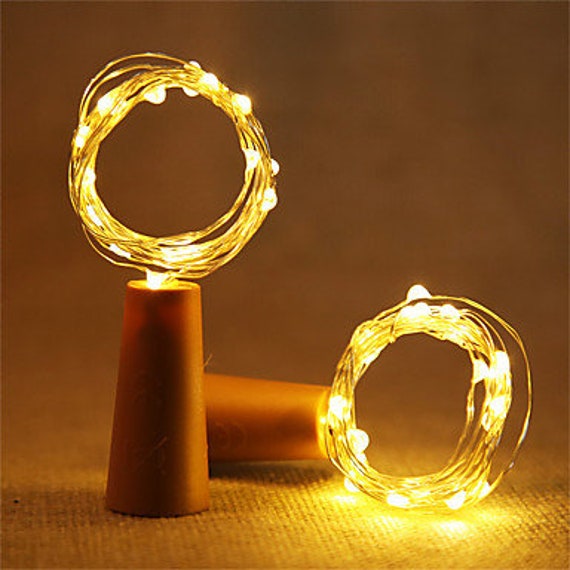 Paquete de 10 luces LED con forma de corcho de color plateado y alambre de cobre 