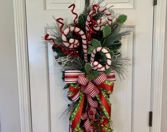 Fun Whimsical Christmas Candy Cane swag for front door, Sparkling Holiday Red and Green Candy swag