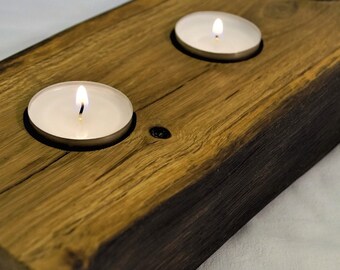 Tealight holder home decoration made from a solid oak trunk.