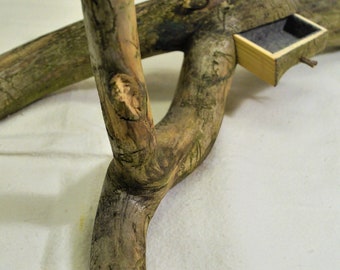 A jewelry box, jewelry stand made from a rustic pine branch.