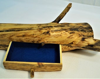 Jewelry box made from a rustic pine trunk.