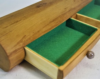 A jewelry box made from a linden tree trunk.