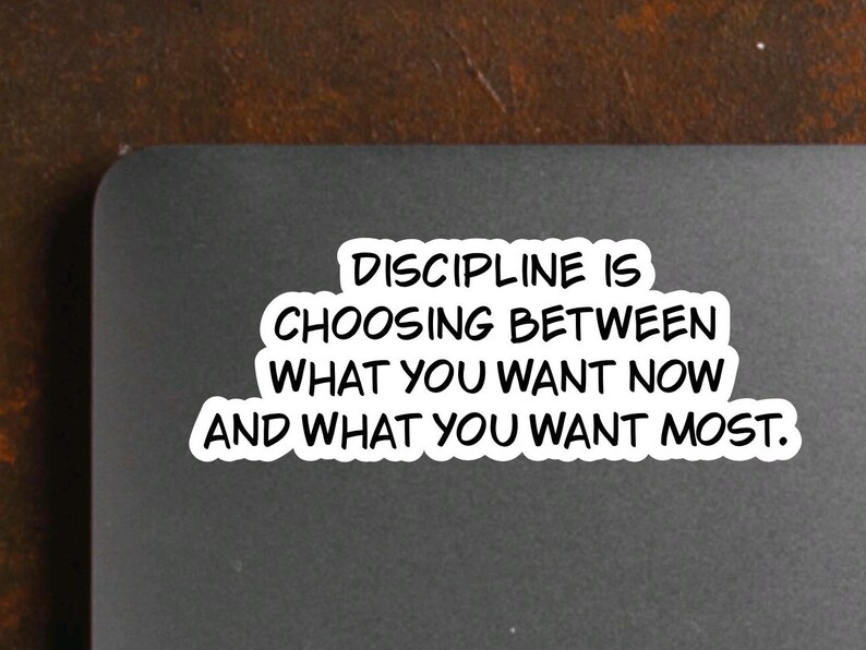 May include: A black and white motivational quote on a gray background. The quote reads "Discipline is choosing between what you want now and what you want most."