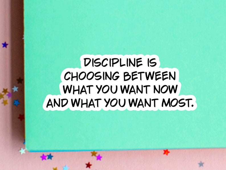 May include: A green background with a white sticker that reads "DISCIPLINE IS CHOOSING BETWEEN WHAT YOU WANT NOW AND WHAT YOU WANT MOST."