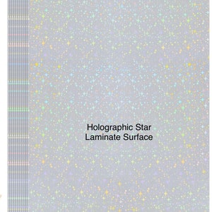 May include: A holographic star laminate surface with a silver background and a rainbow of colors. The text "Holographic Star Laminate Surface" is printed in black.