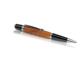 Handmade ballpoint pen made of cherry wood